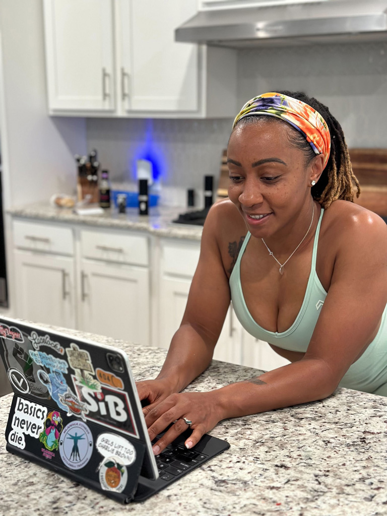 picture of the coach in front of computer